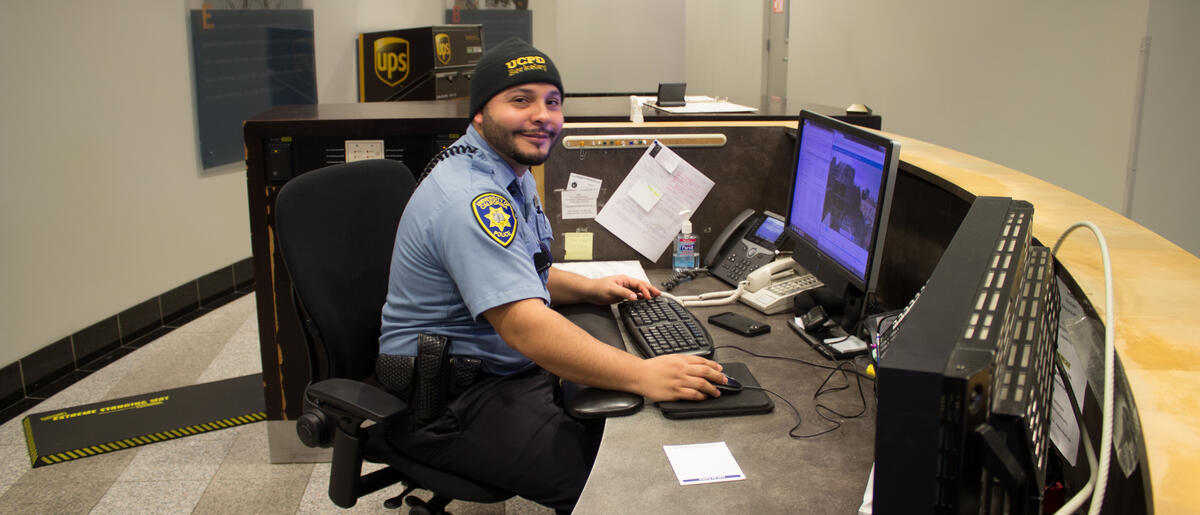 Image of Security Patrol Officer sitting and command desk